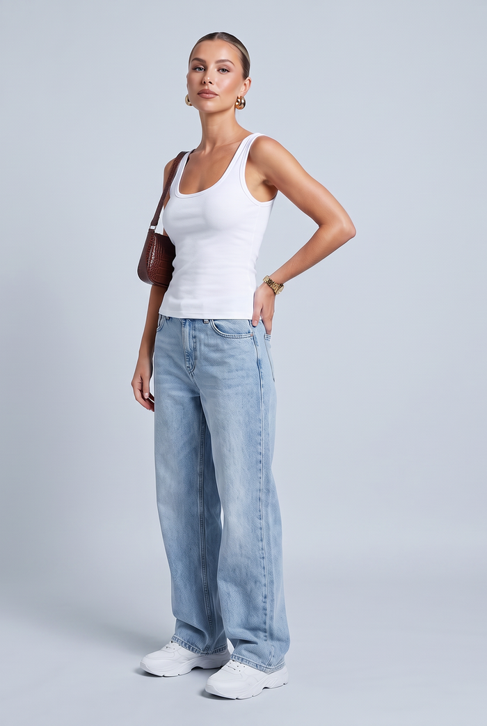 Kovelle scoop neck rib vest in white, three-quarter view on model