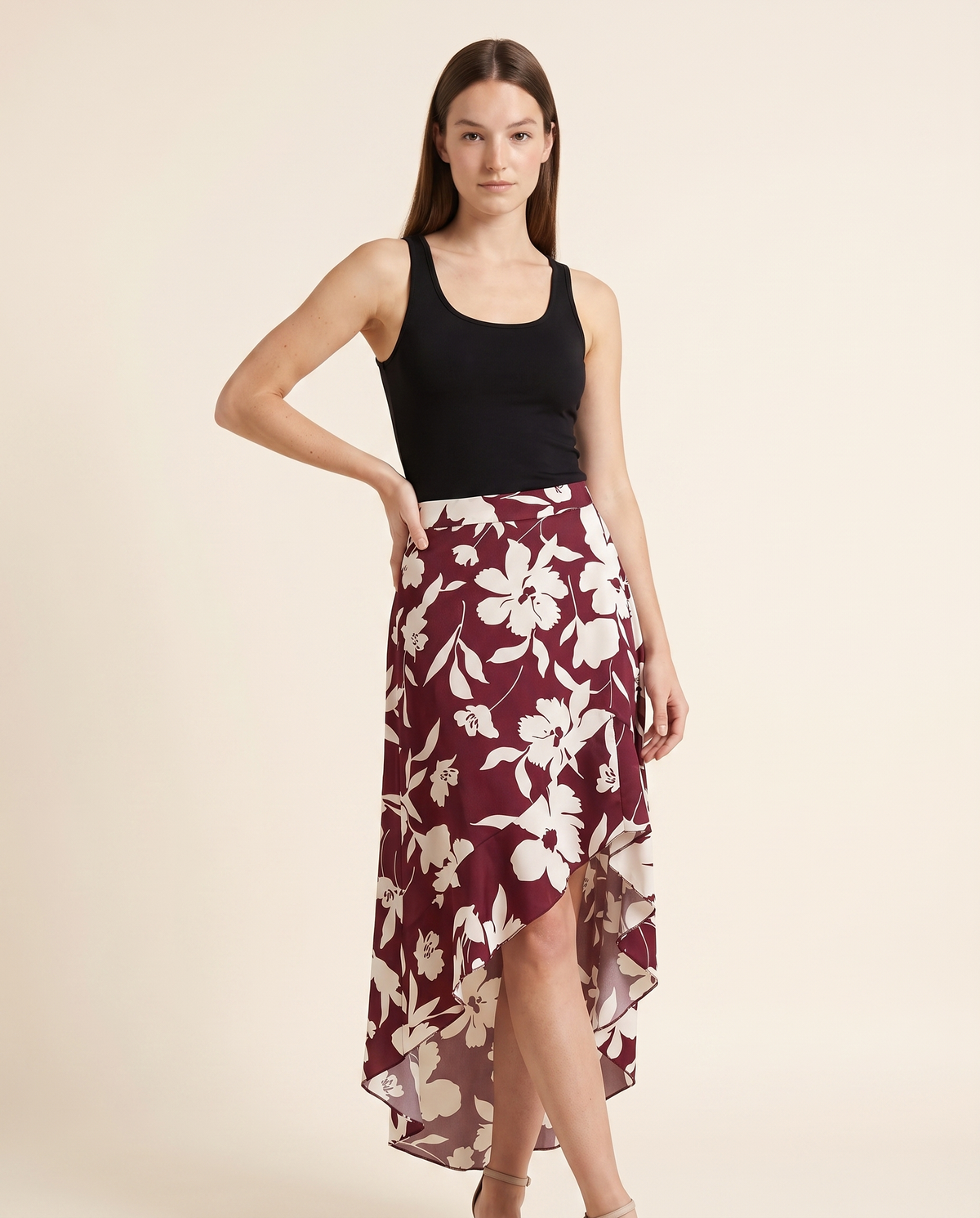 Kovelle floral asymmetric midi skirt three quarter view, on model