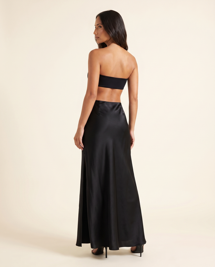Kovelle black satin maxi skirt back view, on model