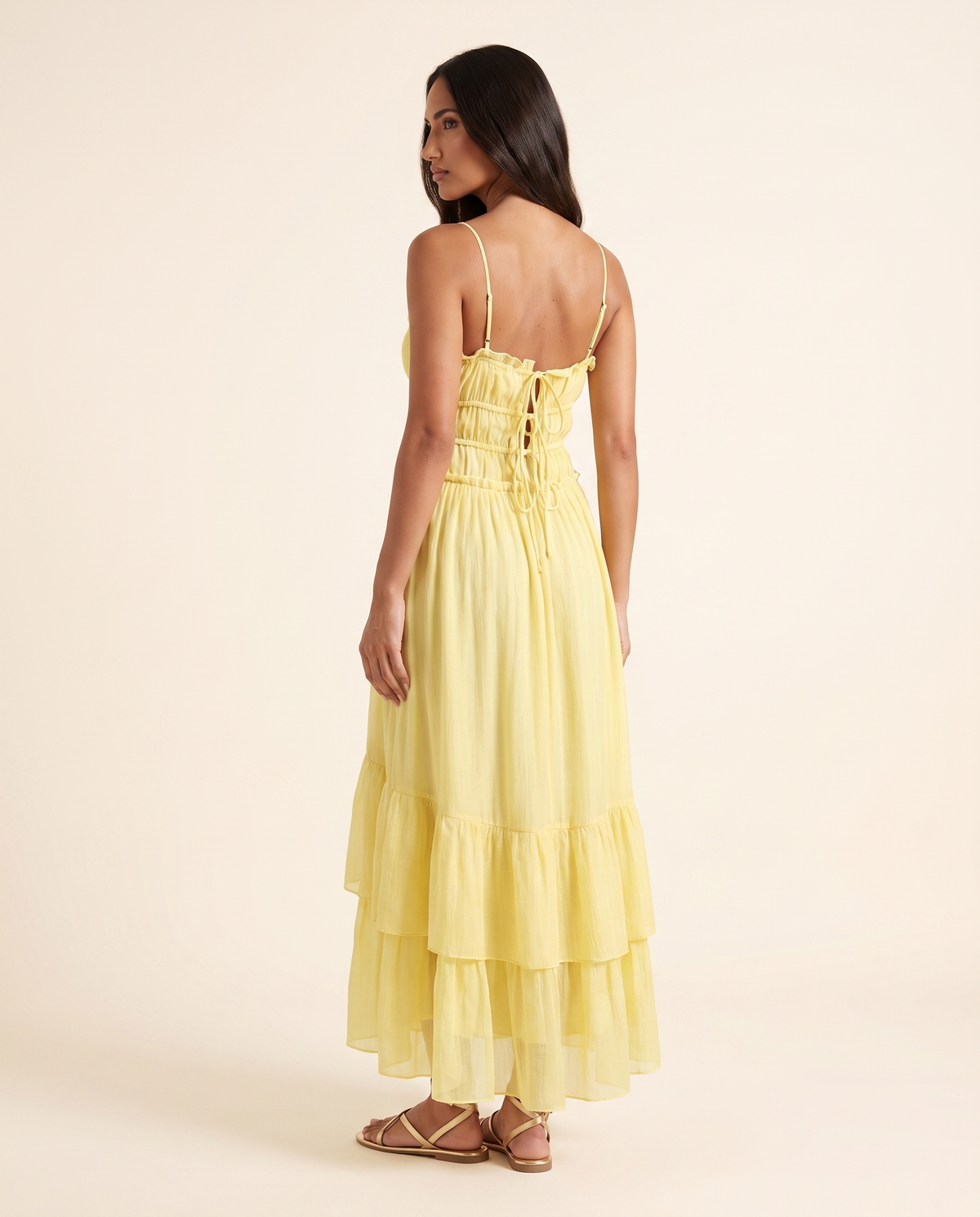 Kovelle yellow tiered maxi back view showing lace-up detail, on model