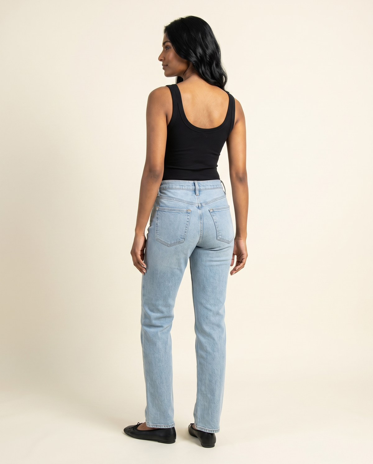 Kovelle black ribbed bodysuit back view, on model