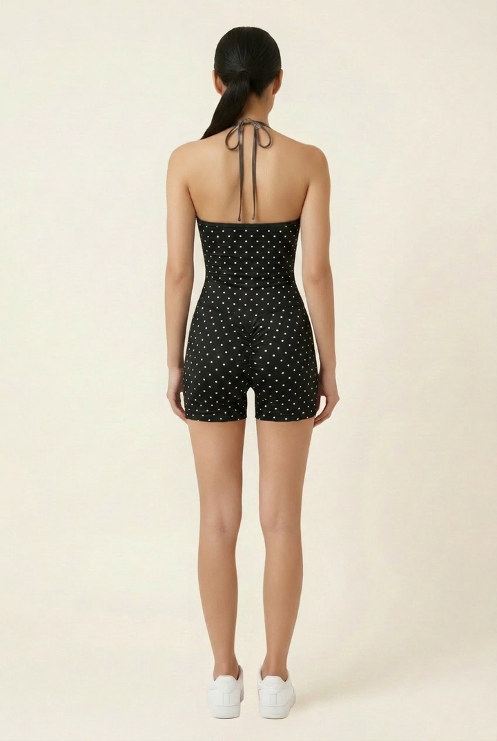 Kovelle polka dot halter gym set in black, back view with halter tie on model