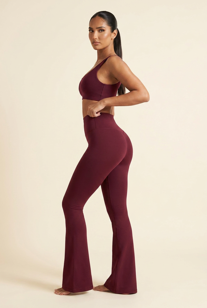 Kovelle high waist flare leggings in wine red, over the shoulder, on model