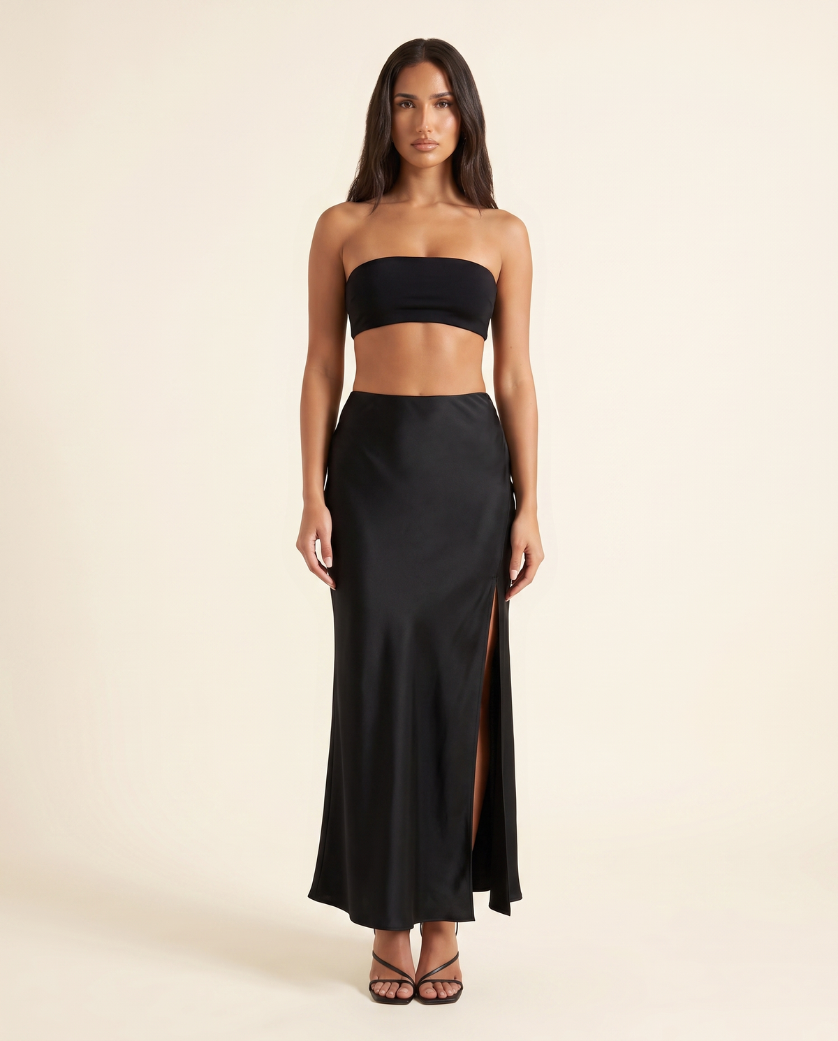 Kovelle black satin maxi skirt, front studio view on model