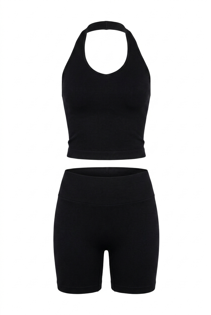 The Kovelle Halter Vest Gym Set in black photographed on its own against a white background, showing the vest and matching shorts