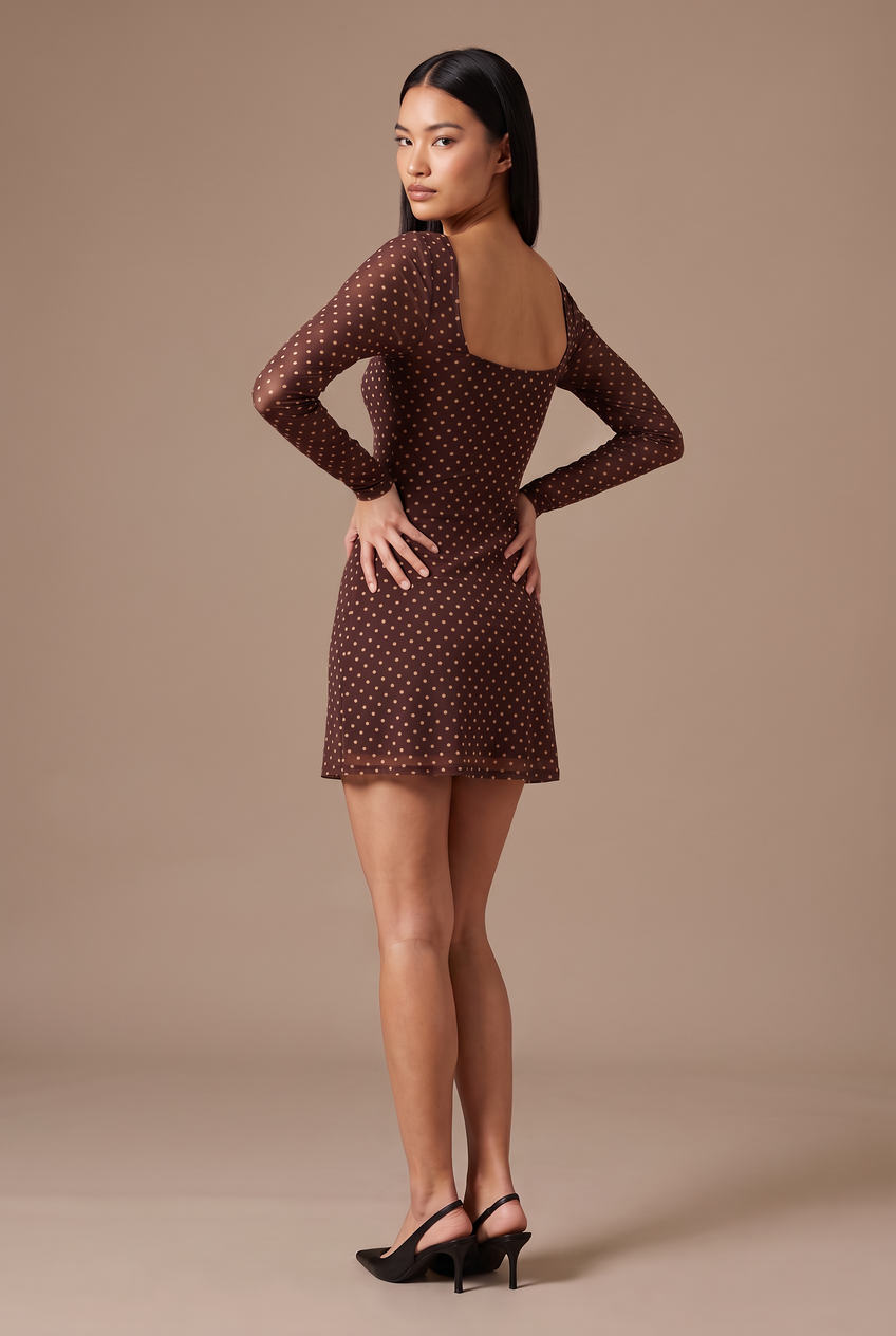 Kovelle brown polka dot long sleeve mini dress in brown, back view on model
