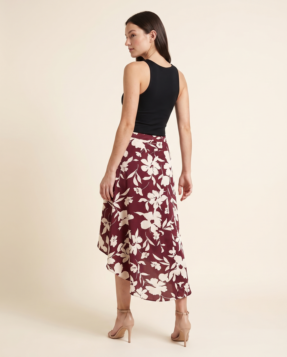 Kovelle burgundy floral ruffle skirt back view, on model