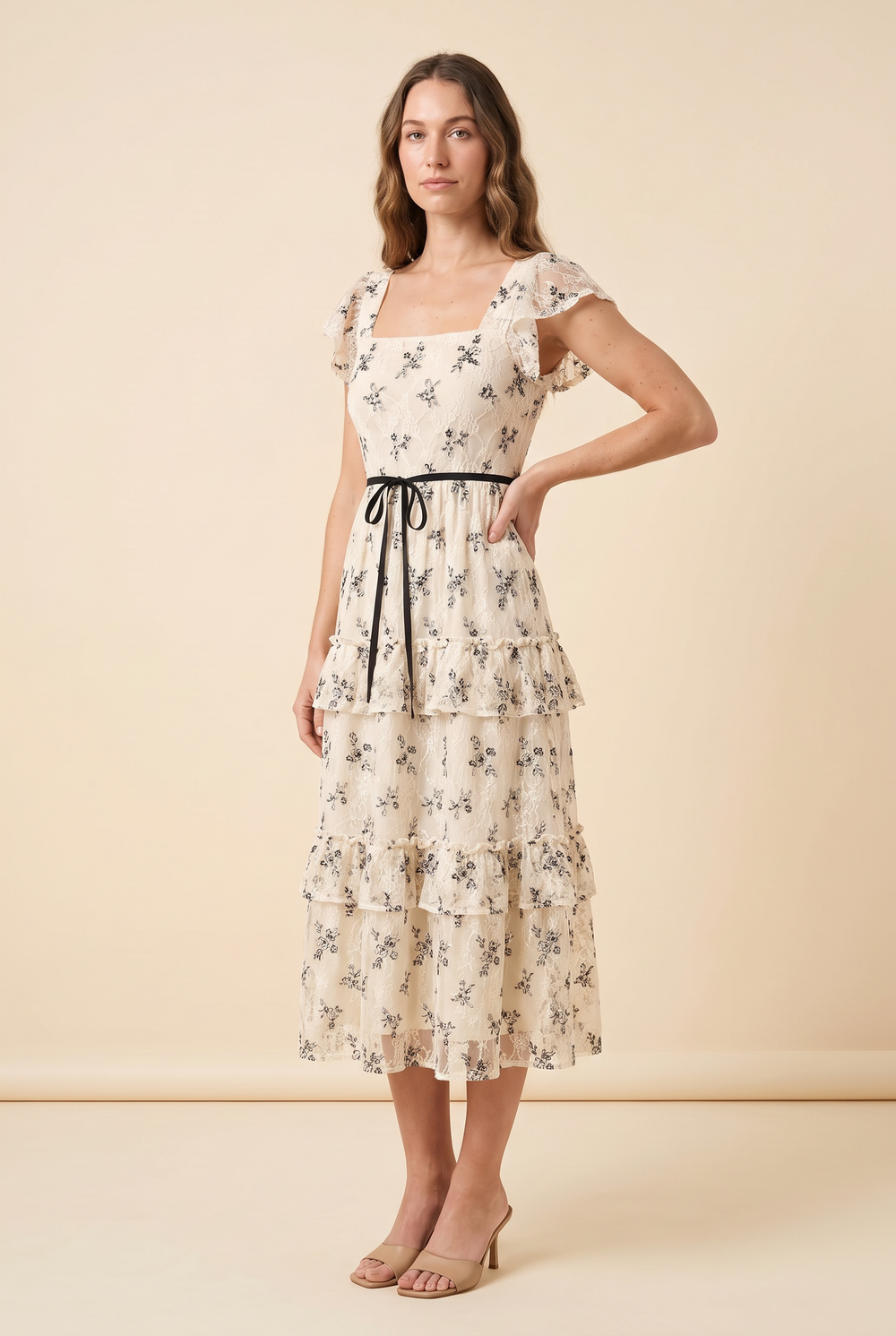 Kovelle floral embroidered lace midi dress in ivory floral, three-quarter view on model