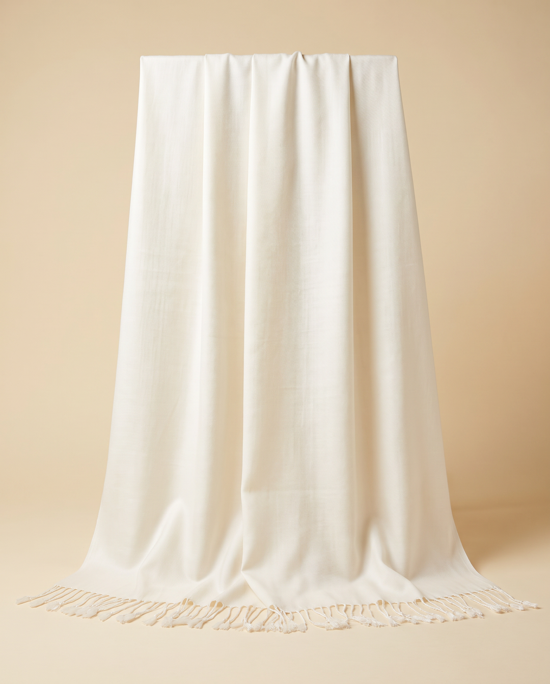 Ivory pashmina shawl with tasselled ends, front