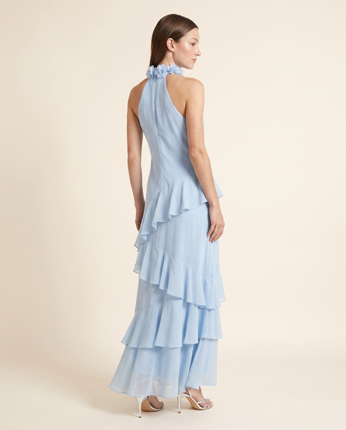 Kovelle blue ruffle maxi back view showing halter neck, on model