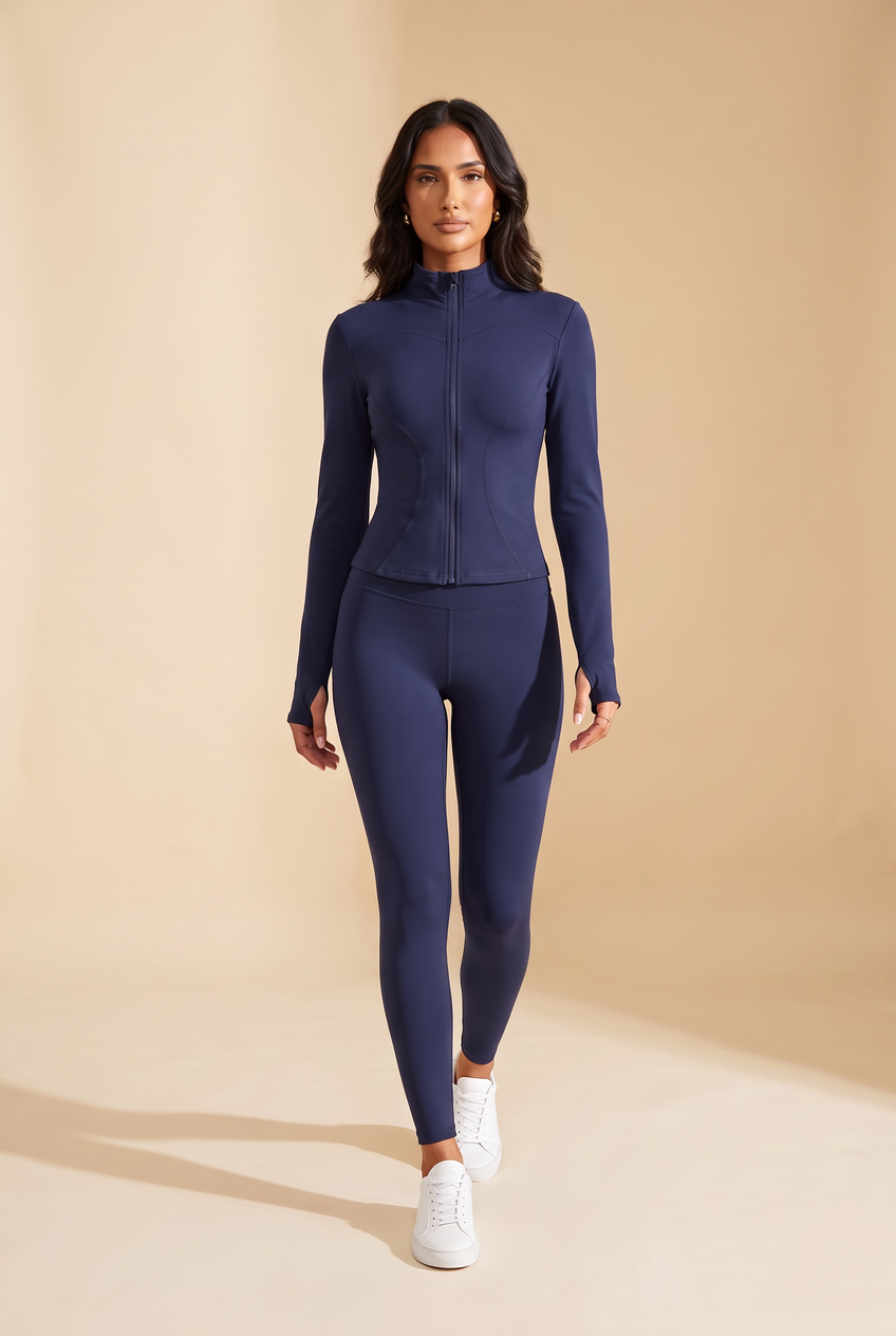 Kovelle zip-through gym jacket in navy, walking, full length on model