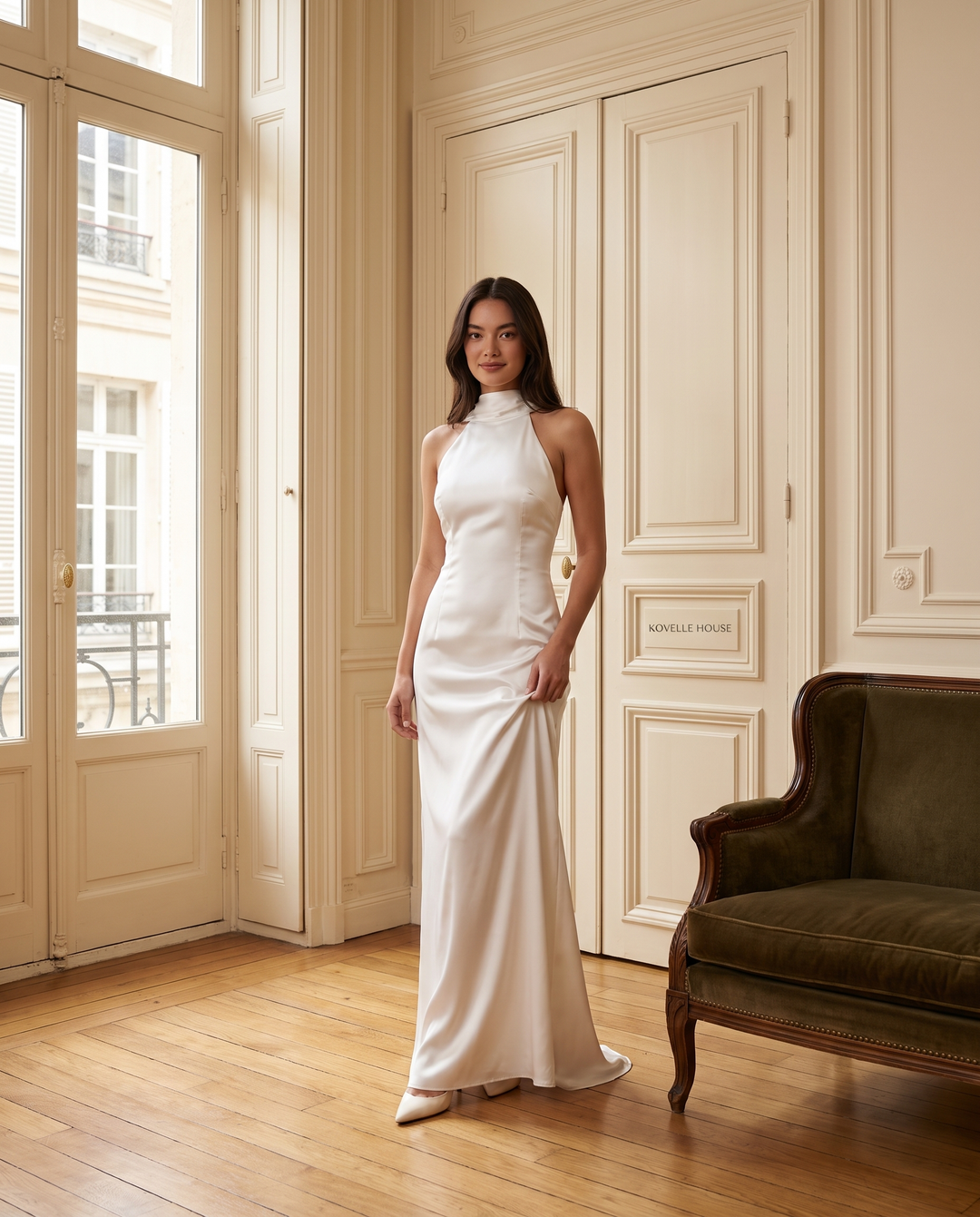Kovelle white satin halter maxi gown, on model in the Kovelle House salon