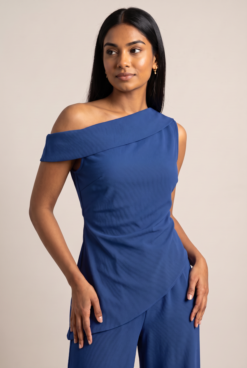 Kovelle asymmetric draped trouser set in cobalt, close-up detail on model