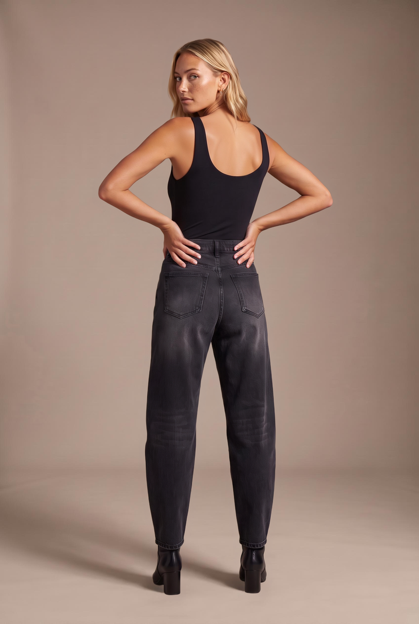 Kovelle barrel leg jeans in washed black, back view on model