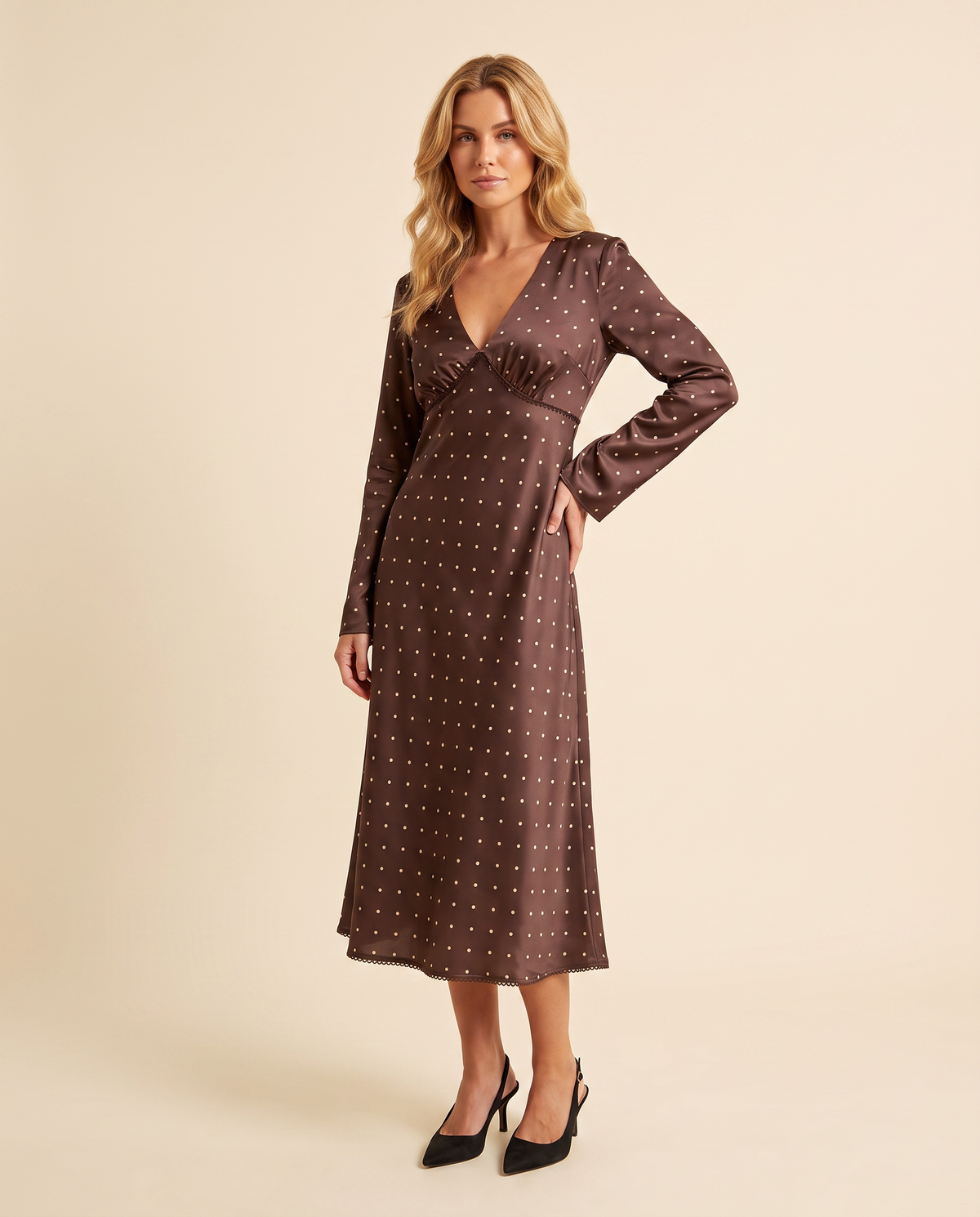 Kovelle chocolate dot midi dress three quarter view showing A-line skirt, on model