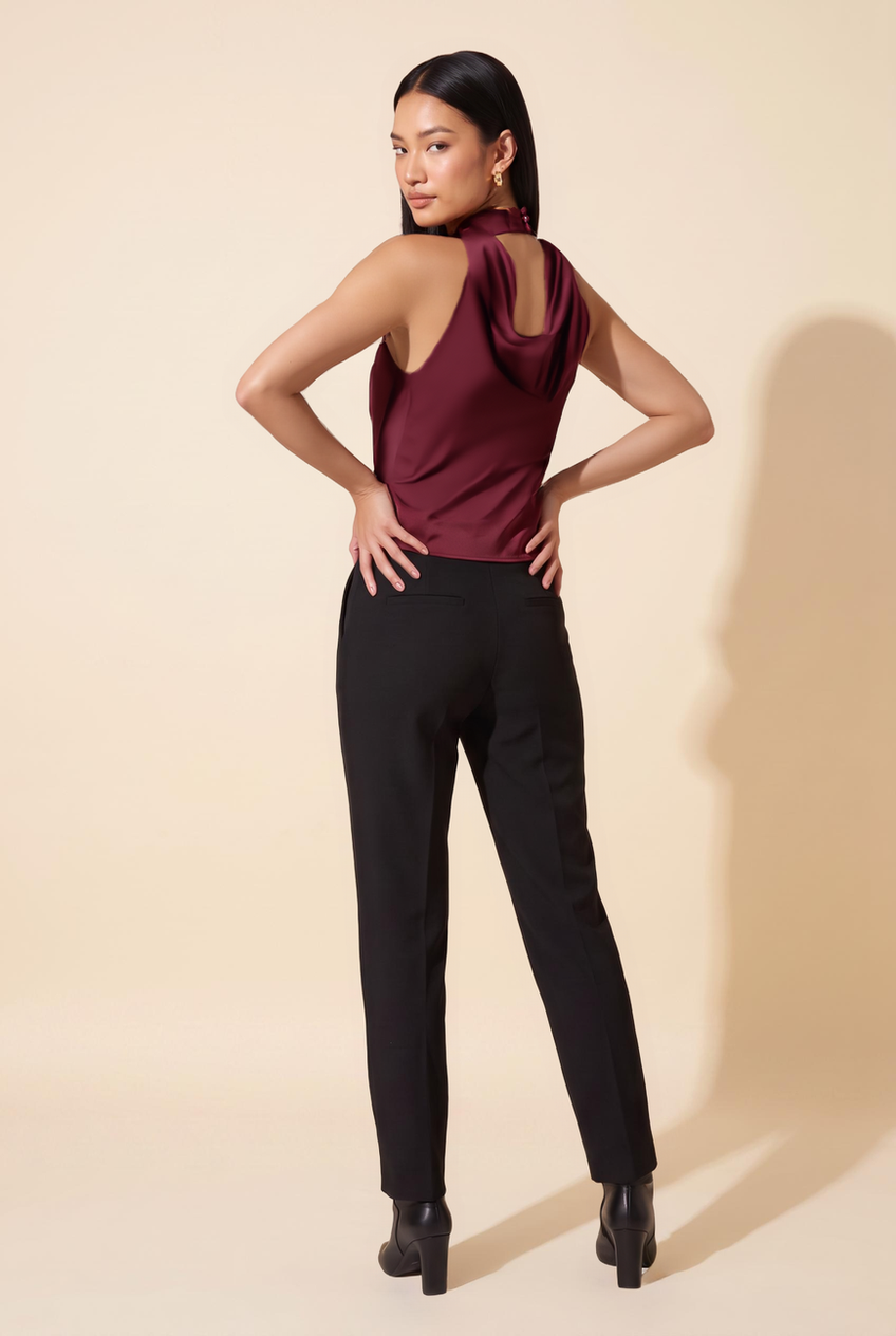 Kovelle cowl halter satin top in maroon, back view on model
