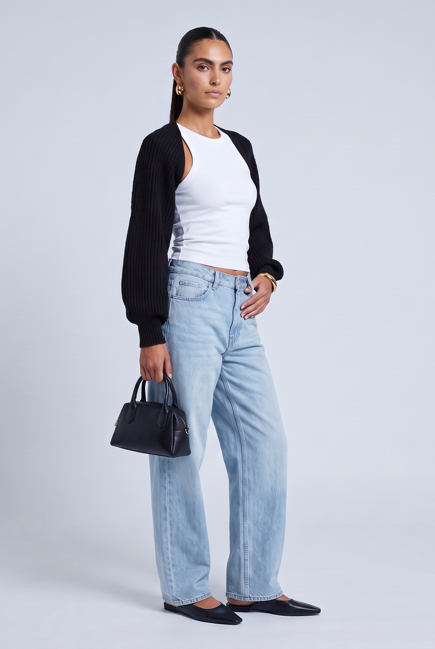 Kovelle cropped knit bolero in black, front view on model
