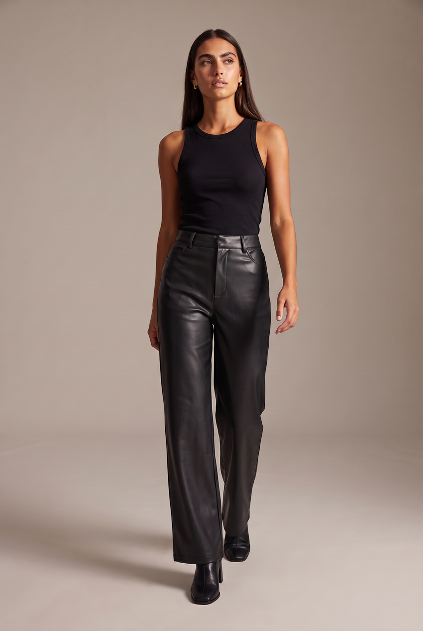 Kovelle faux leather wide leg trousers in black, walking, full length on model