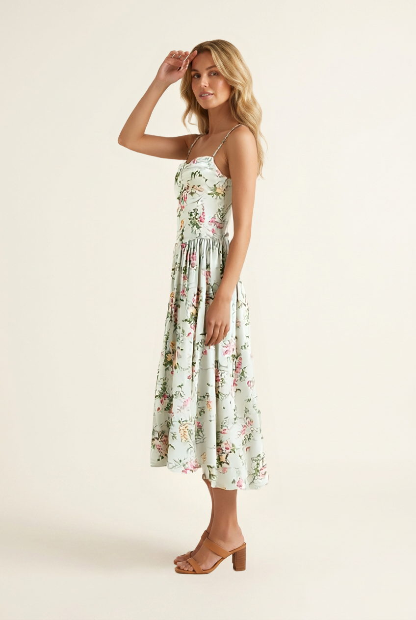 Kovelle floral corset A-line midi dress in sage floral, side view on model
