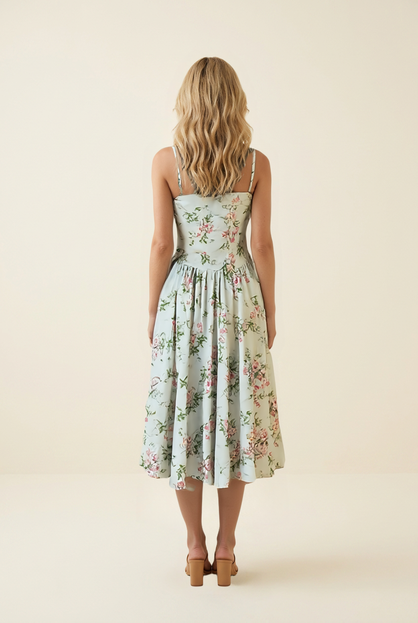 Kovelle floral corset A-line midi dress in sage floral, back view showing corset bodice on model