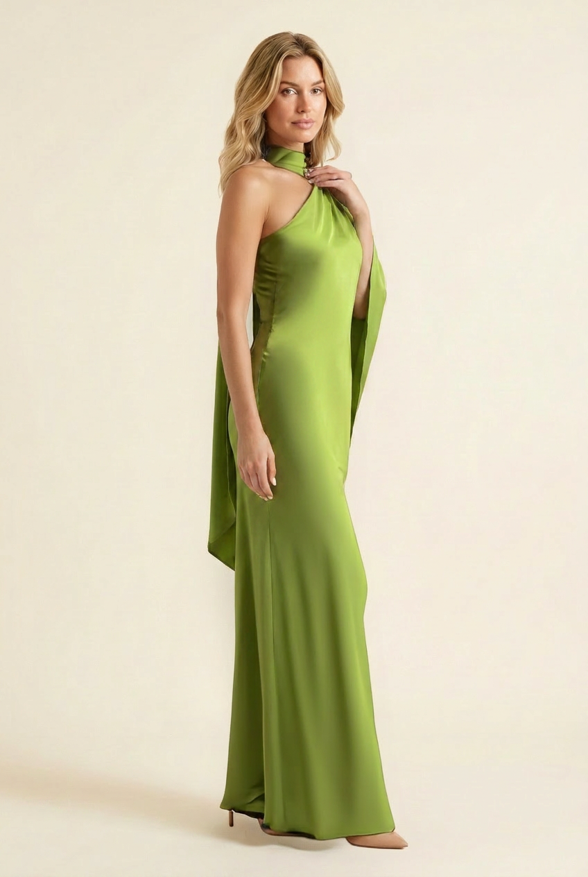 Kovelle halter cape back satin maxi dress in green, side view with cape drape on model