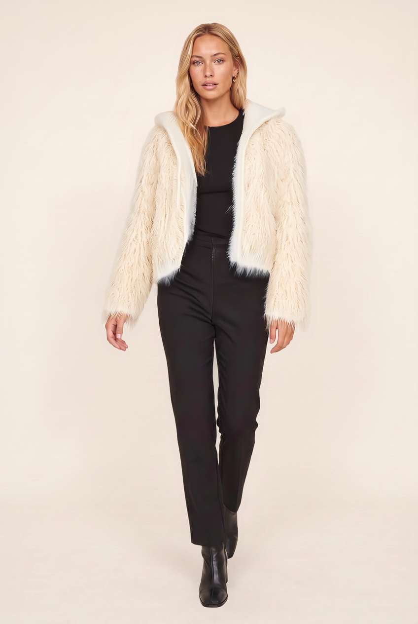 Kovelle hooded cropped faux fur jacket in cream, walking, full length on model