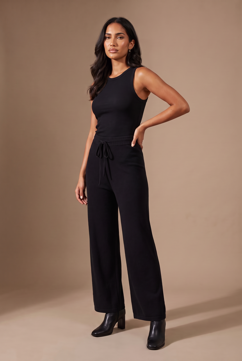 Kovelle knitted wide leg trousers in black, front view on model