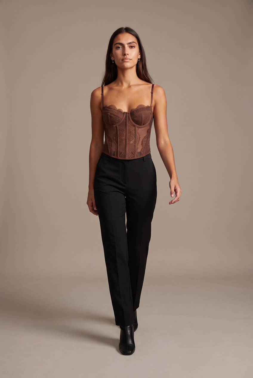Kovelle lace bustier top in chocolate, walking, full length on model