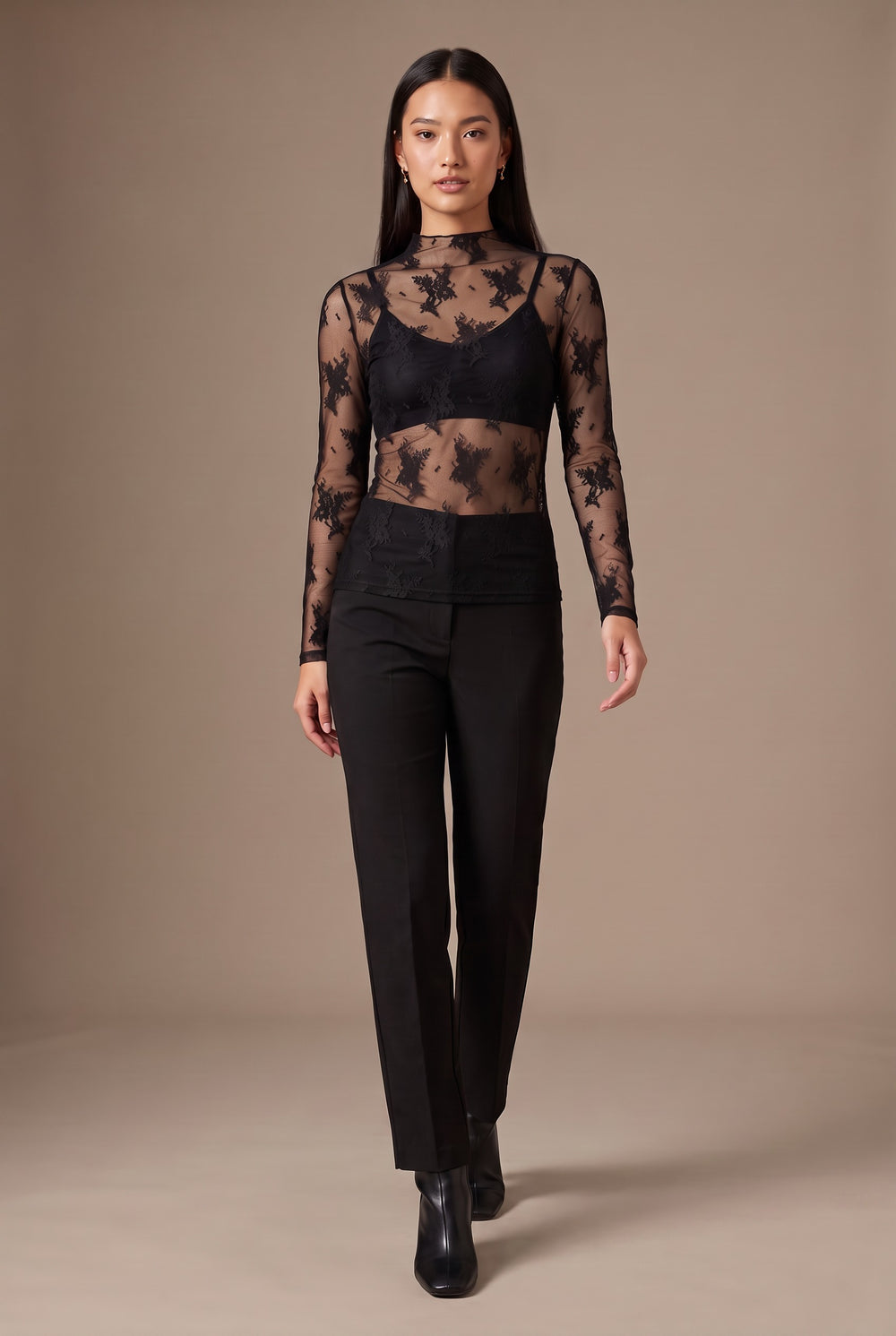 Kovelle lace high neck top in black, walking, full length on model