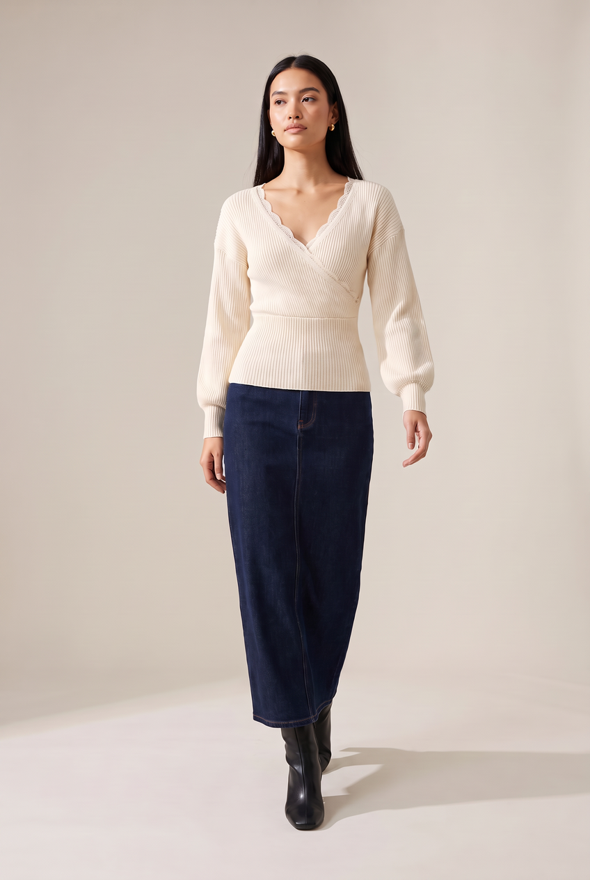 Kovelle lace trim wrap knit top in cream, walking, full length on model