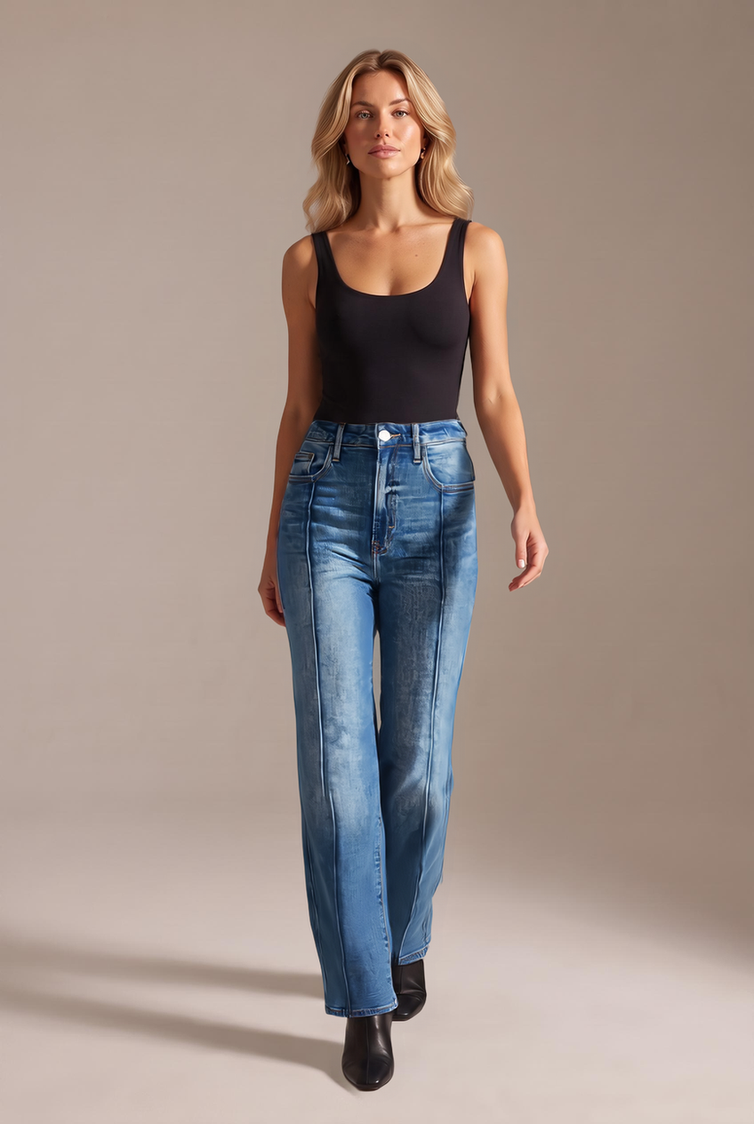 Kovelle mid-rise straight leg jeans in mid blue, walking, full length on model