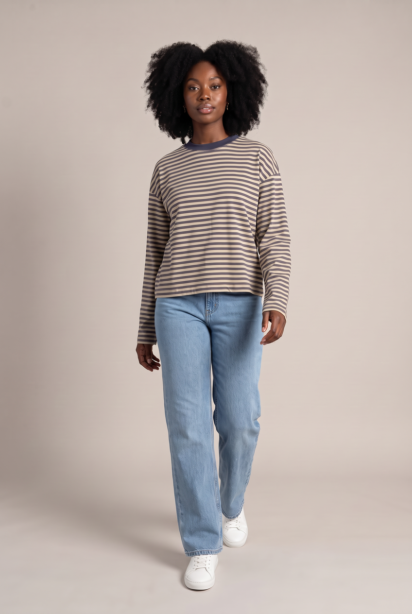 Kovelle oversized striped long sleeve tee in khaki stripe, walking, full length on model