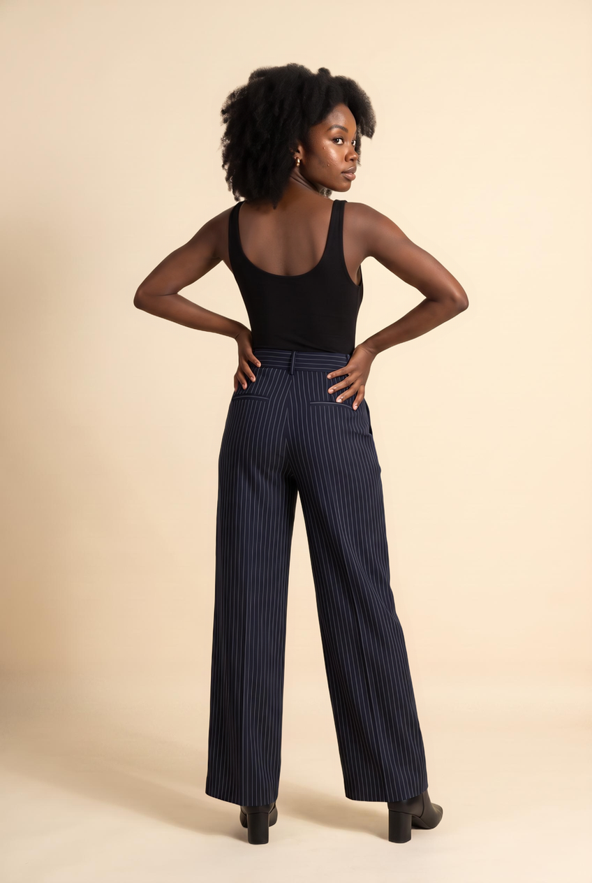 Kovelle pinstripe pleat-front trousers in navy pinstripe, back view on model