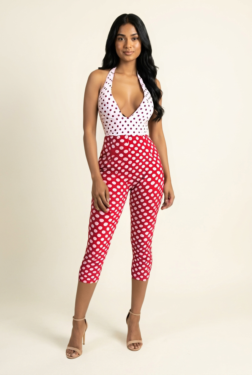 Kovelle polka dot halter capri jumpsuit in red, deep V neckline, front view on model