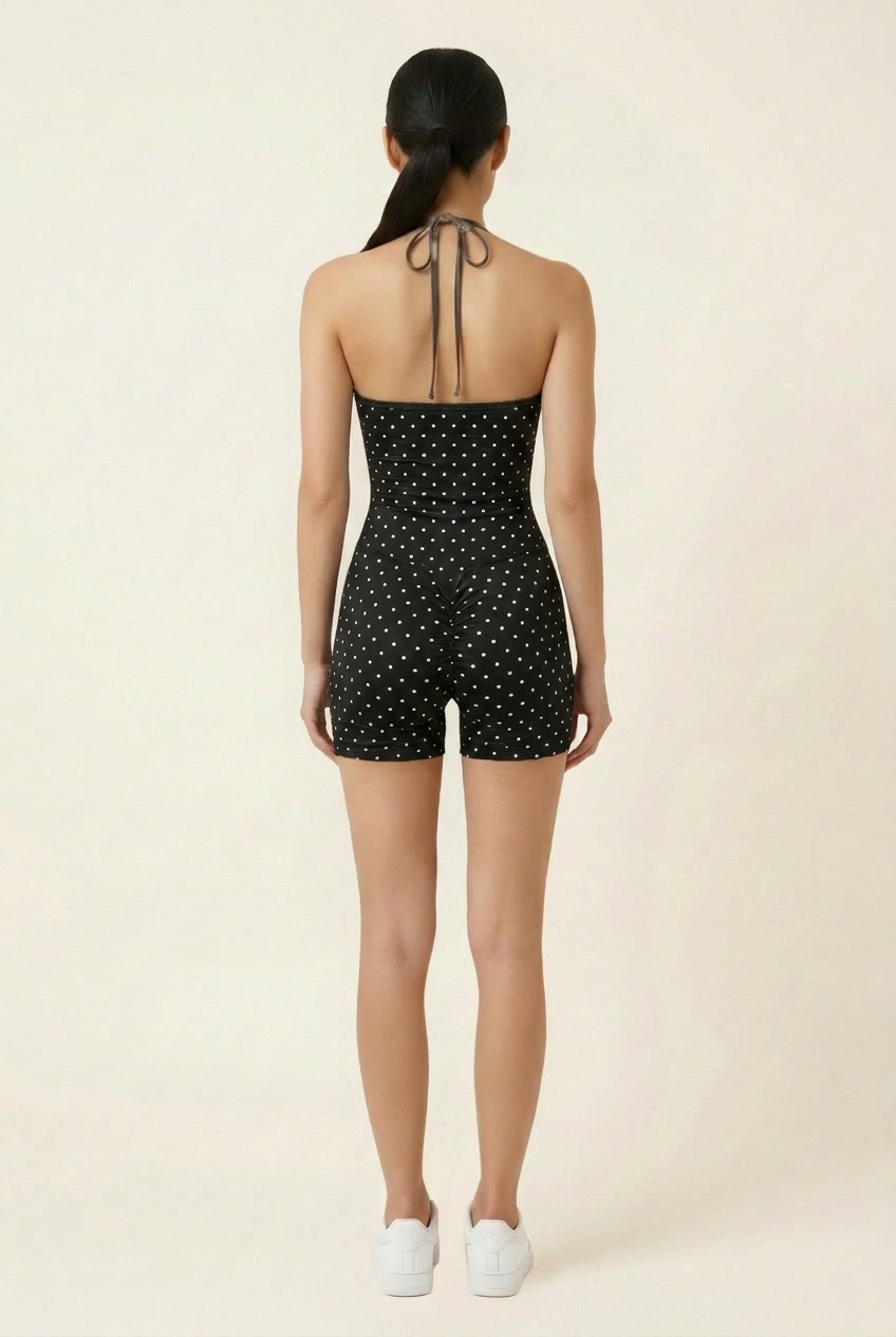 Kovelle polka dot halter gym set in black, back view with halter tie on model