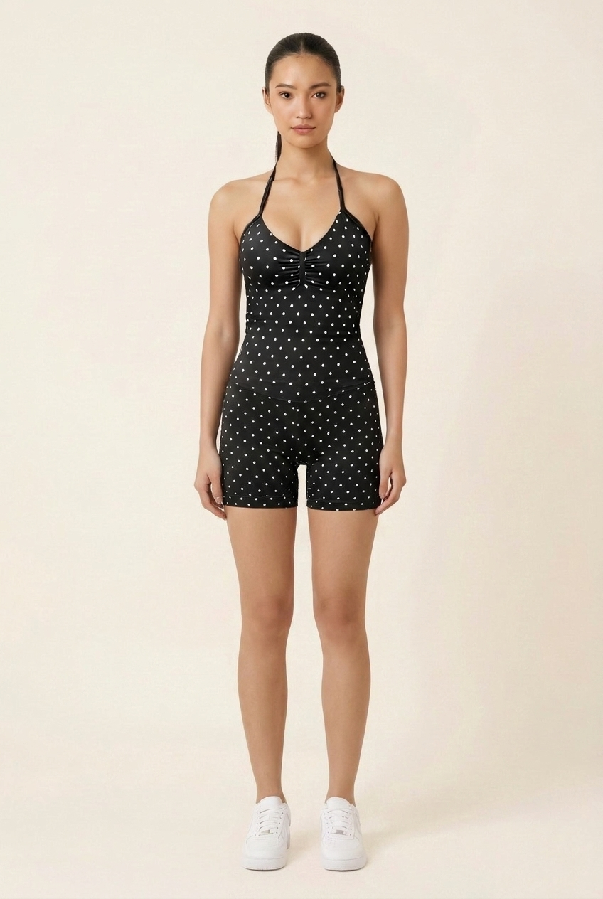 Kovelle polka dot halter gym set in black, front view on model