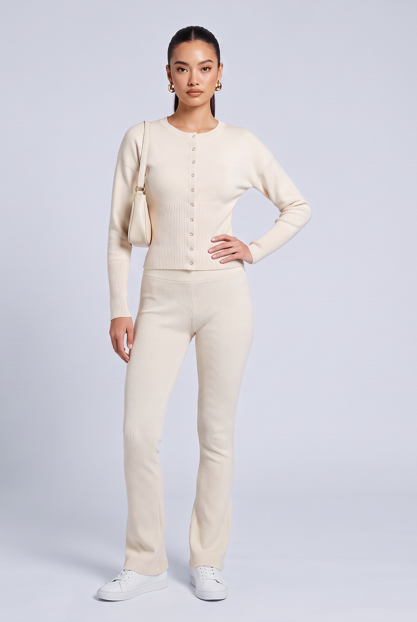 Kovelle rib snap button top in cream, front view on model