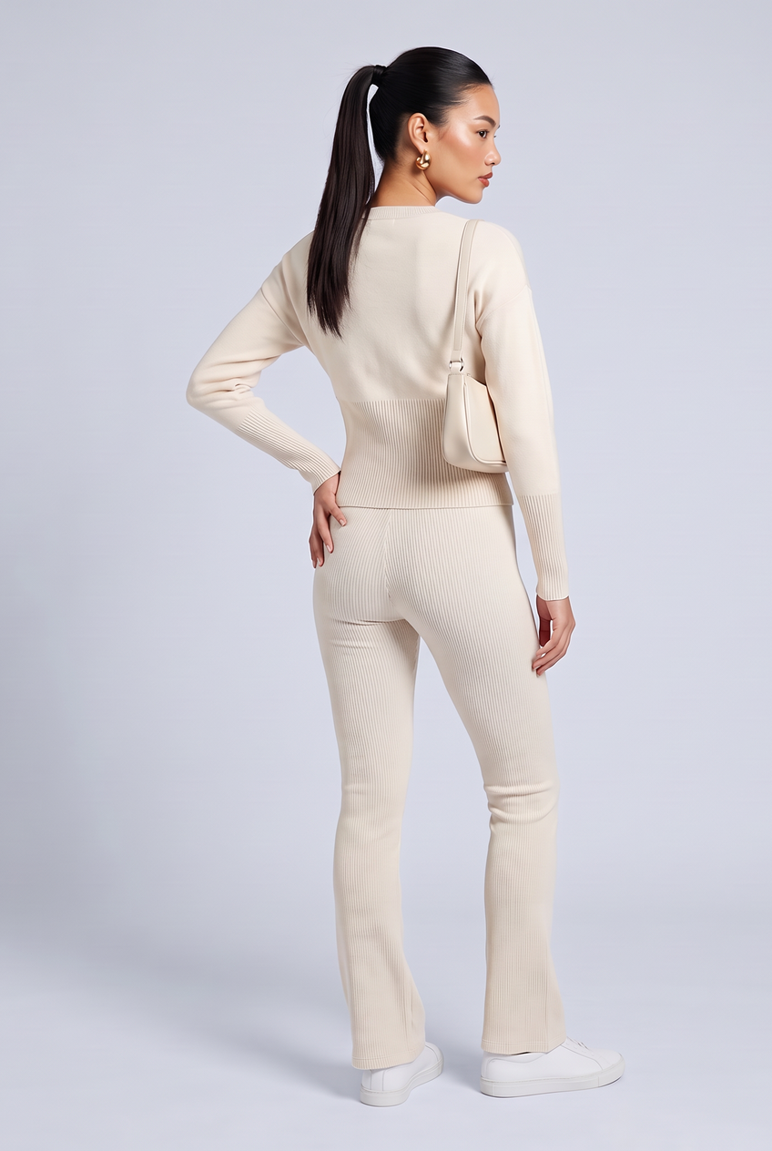 Kovelle rib snap button top in cream, back view on model