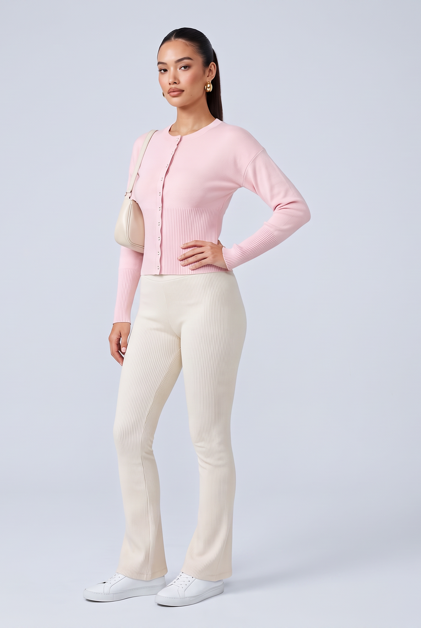 Kovelle rib snap button top in pink, front view on model
