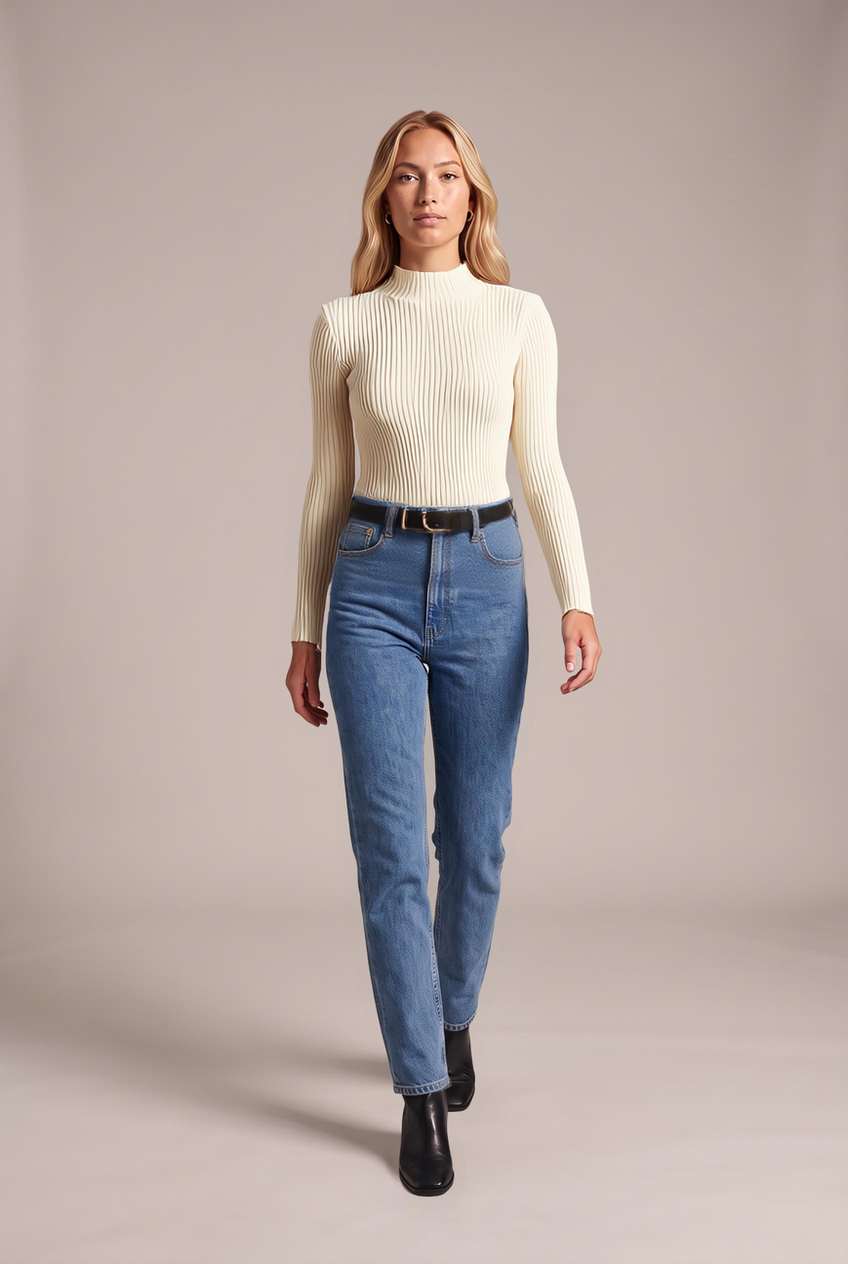 Kovelle ribbed mock neck knit top in cream, walking, full length on model
