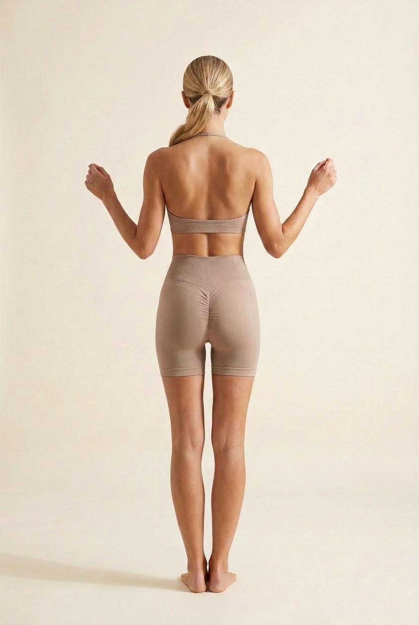 Kovelle ruched seamless gym set in mocha, back view with low bra band and scrunch seam, on model
