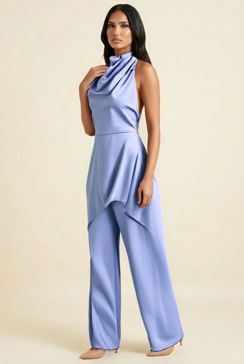 Kovelle satin cowl halter trouser co-ord in blue, side view showing waterfall hem on model
