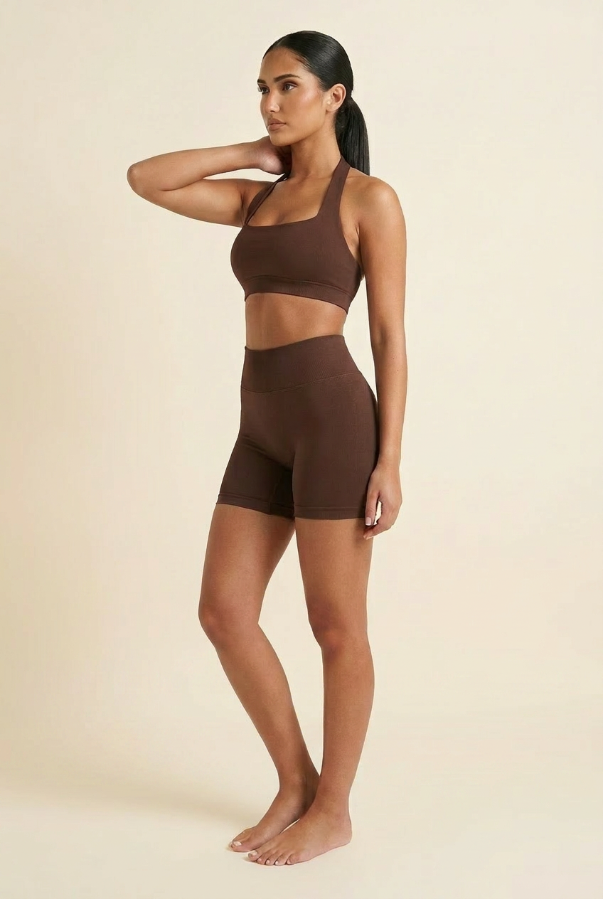 Kovelle seamless halter gym set in chocolate, side view showing halter strap, on model