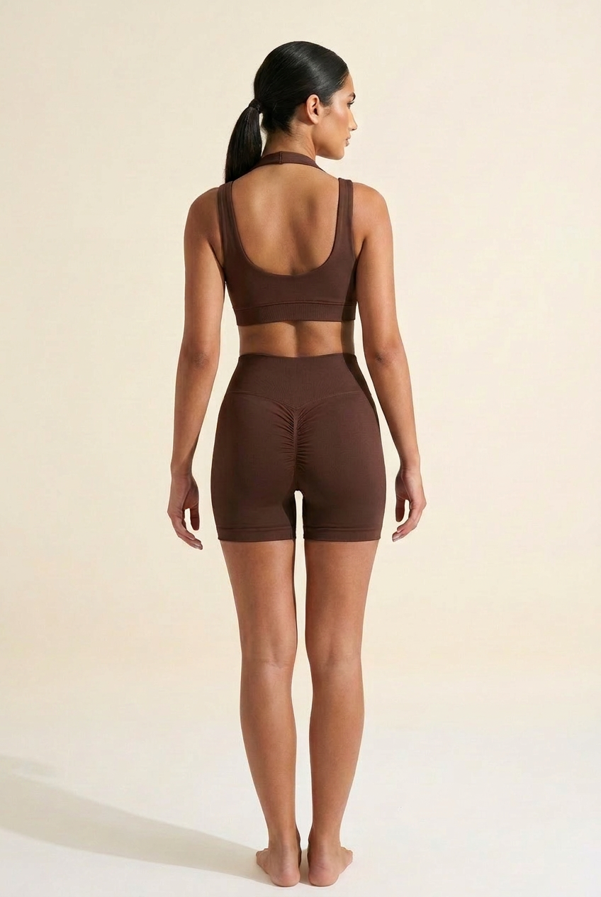 Kovelle seamless halter gym set in chocolate, back view with scrunch bum shorts, on model