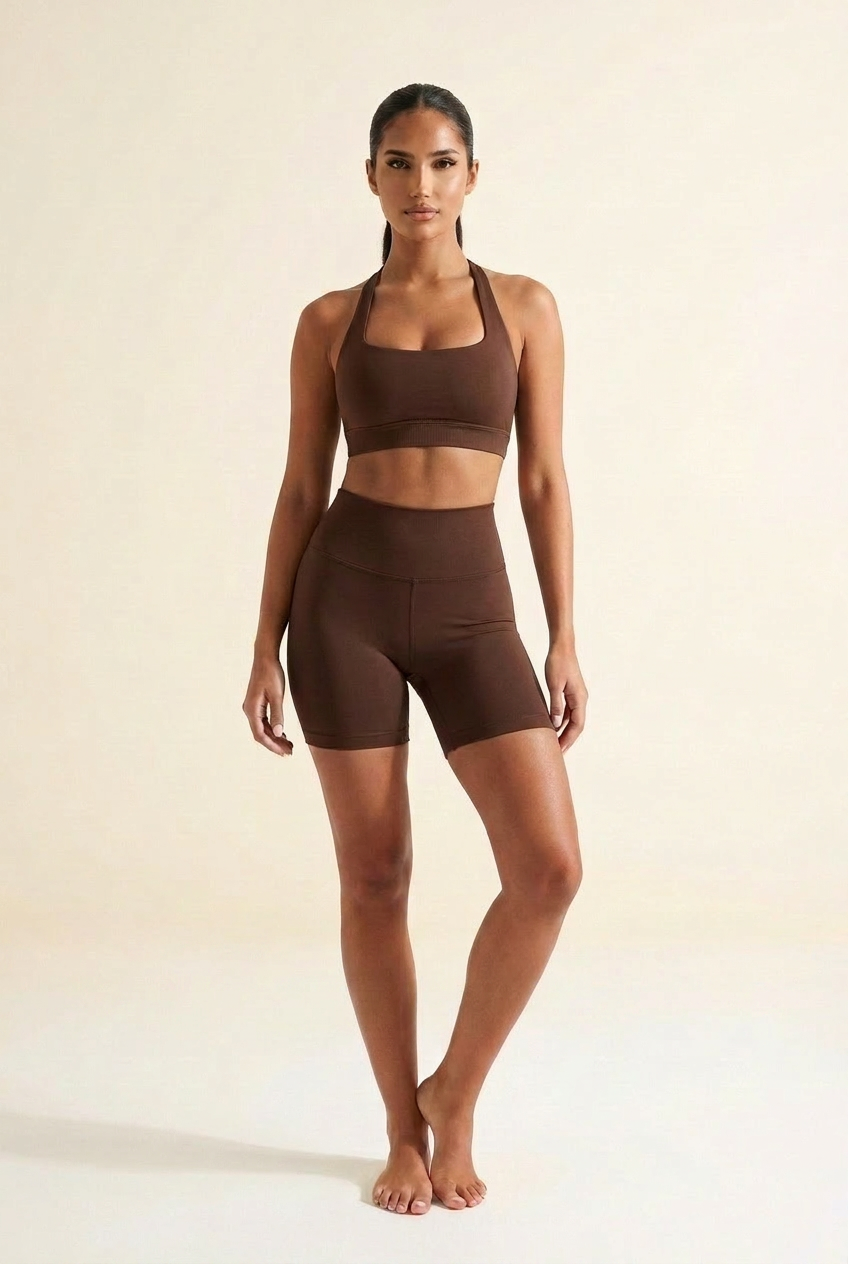 Kovelle seamless halter gym set in chocolate, halter bra and scrunch shorts, front on model