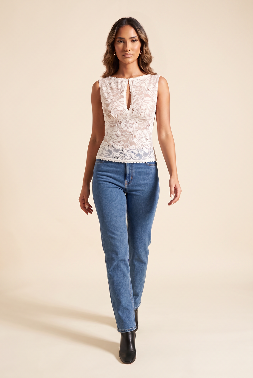 Kovelle sheer lace boat neck top in ivory, walking, full length on model
