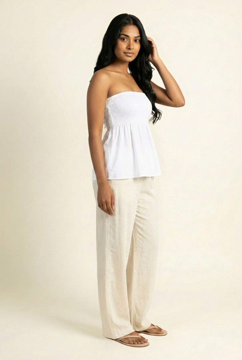 Kovelle shirred bandeau babydoll top in white, side view on model
