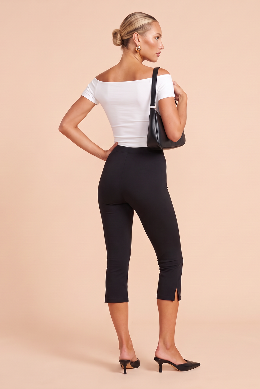 Kovelle split hem capri leggings in black, back view on model