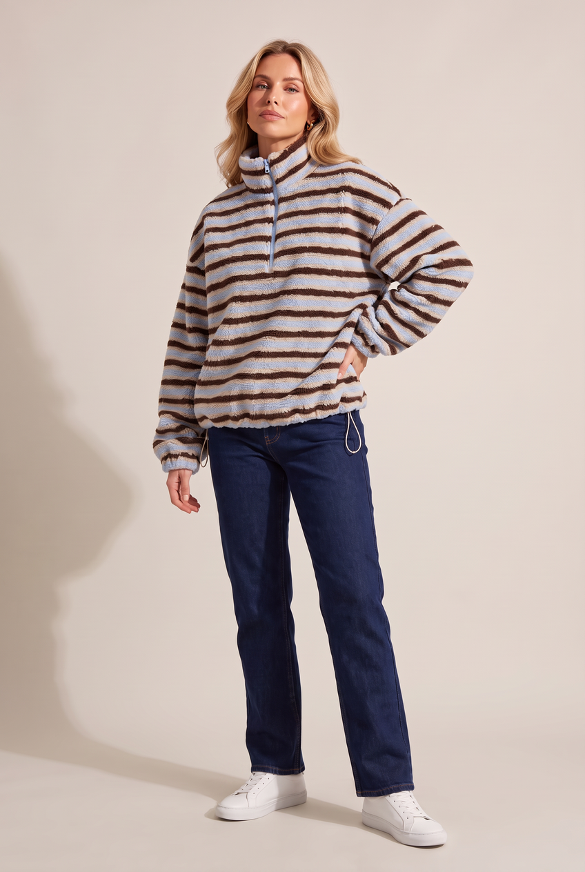Kovelle striped sherpa half zip in blue stripe, three-quarter view on model