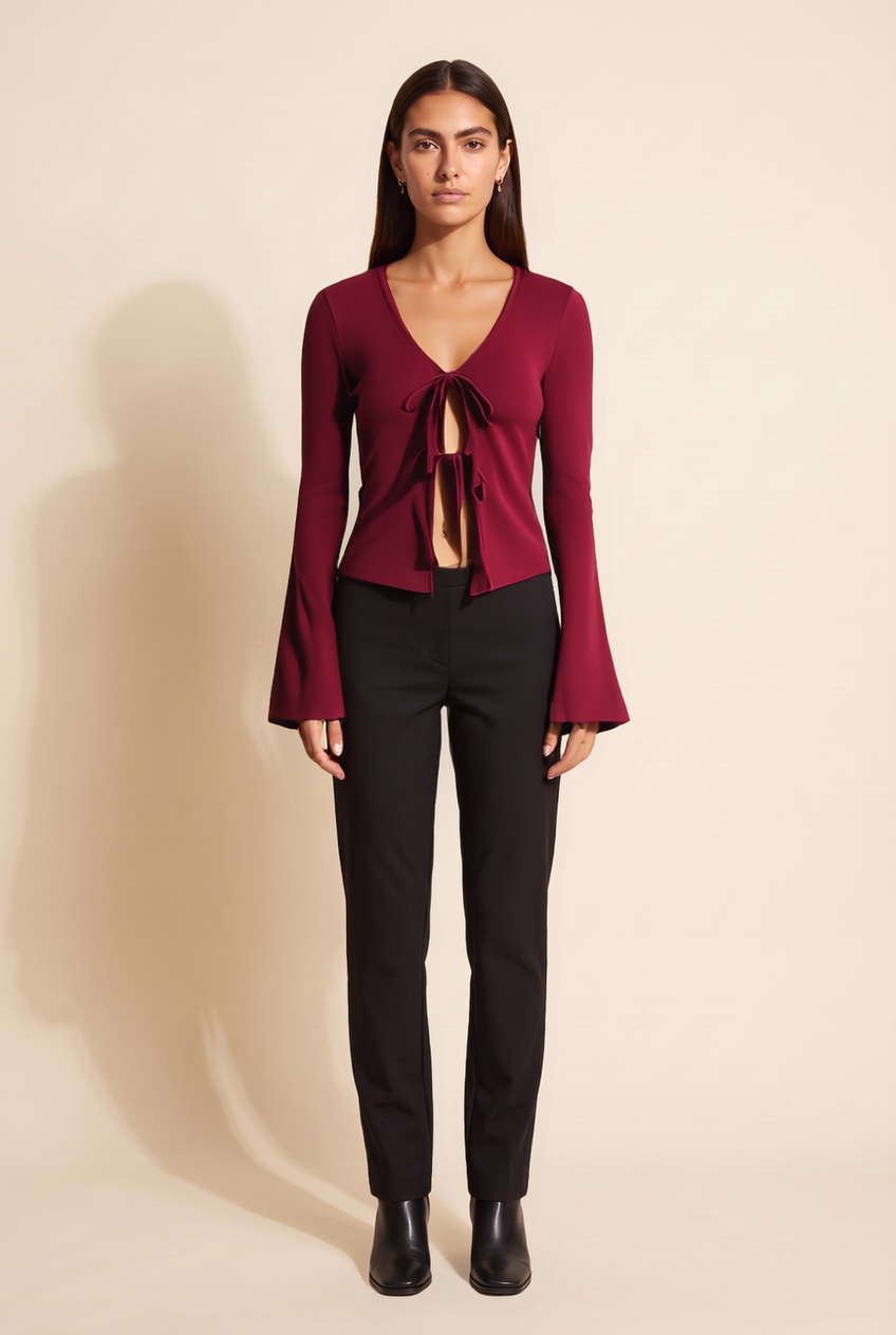 Kovelle tie front knit top in burgundy, front view on model